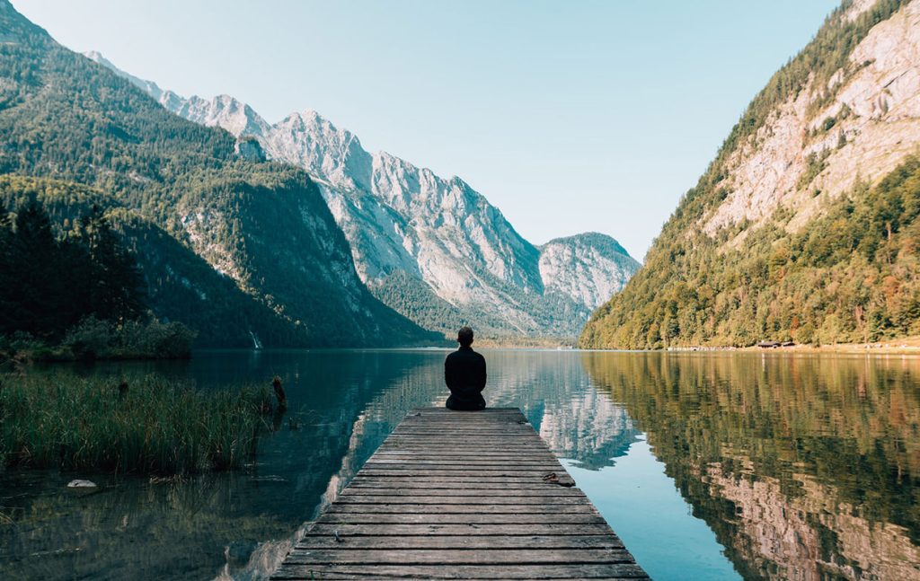 man-sitting-on-grey-dock.jpg