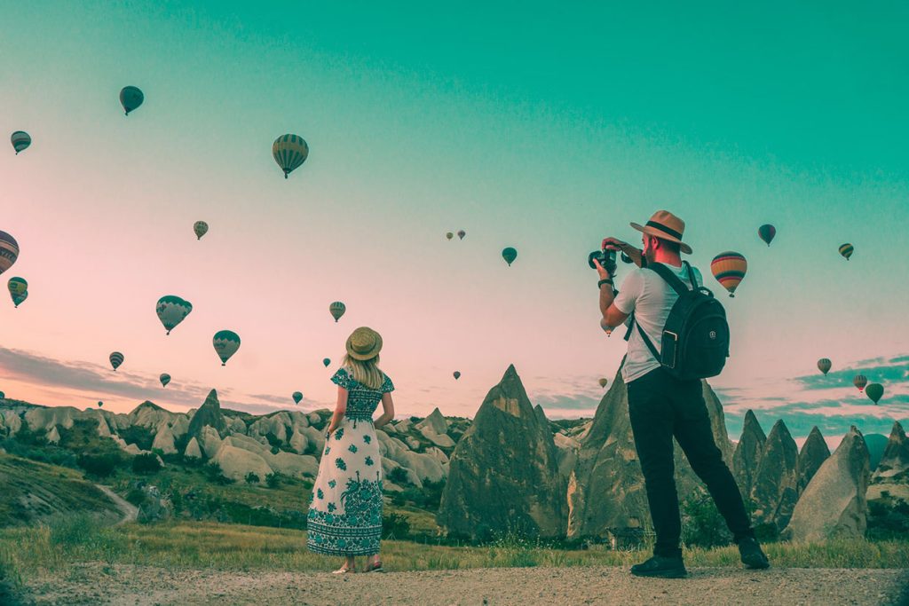 man-taking-photo-of-hot-air-balloons.jpg